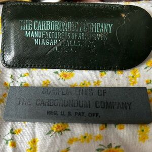 Vintage pocket size whetstone and leather carrying case